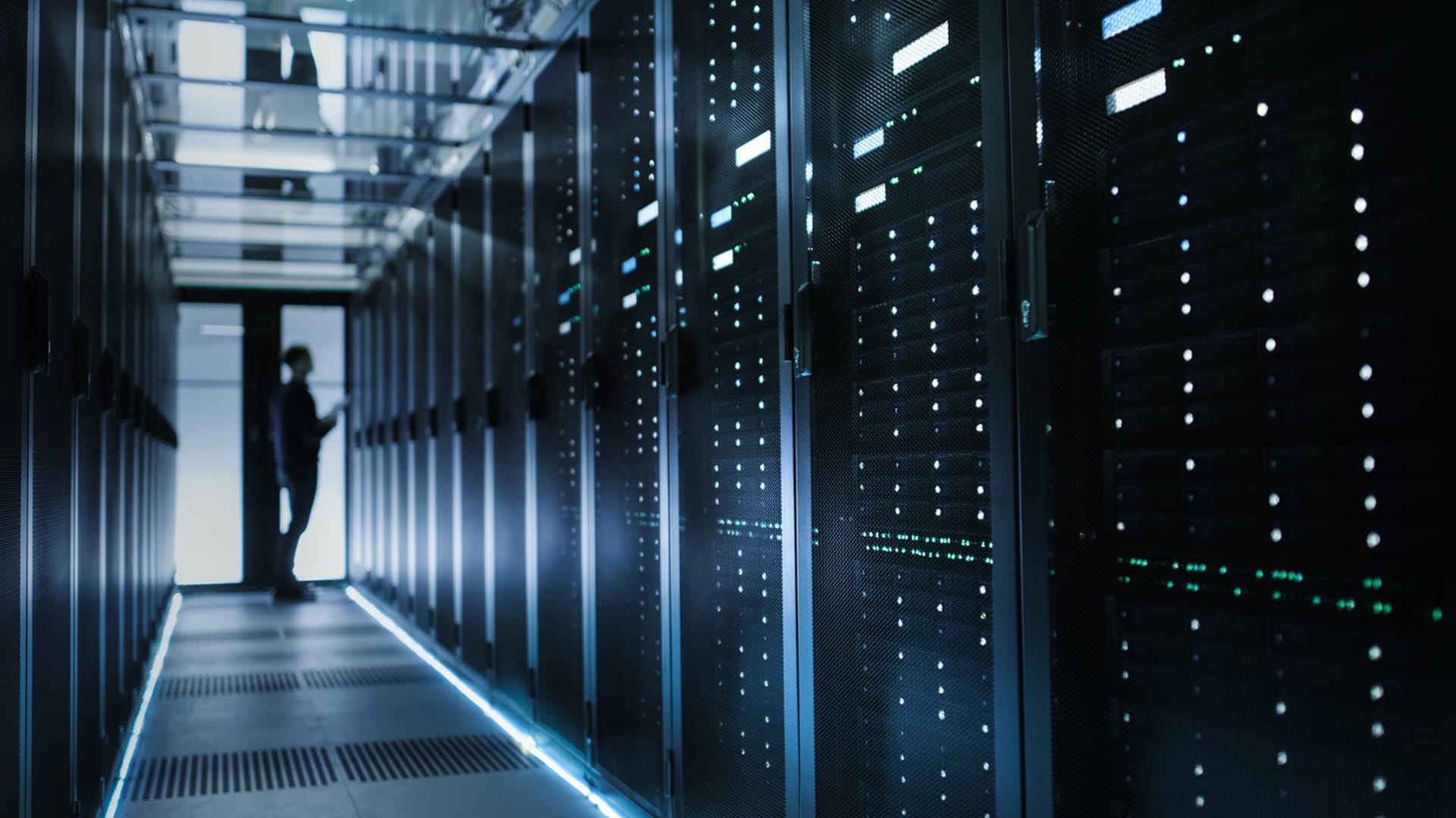 A person checking equipment in a data center