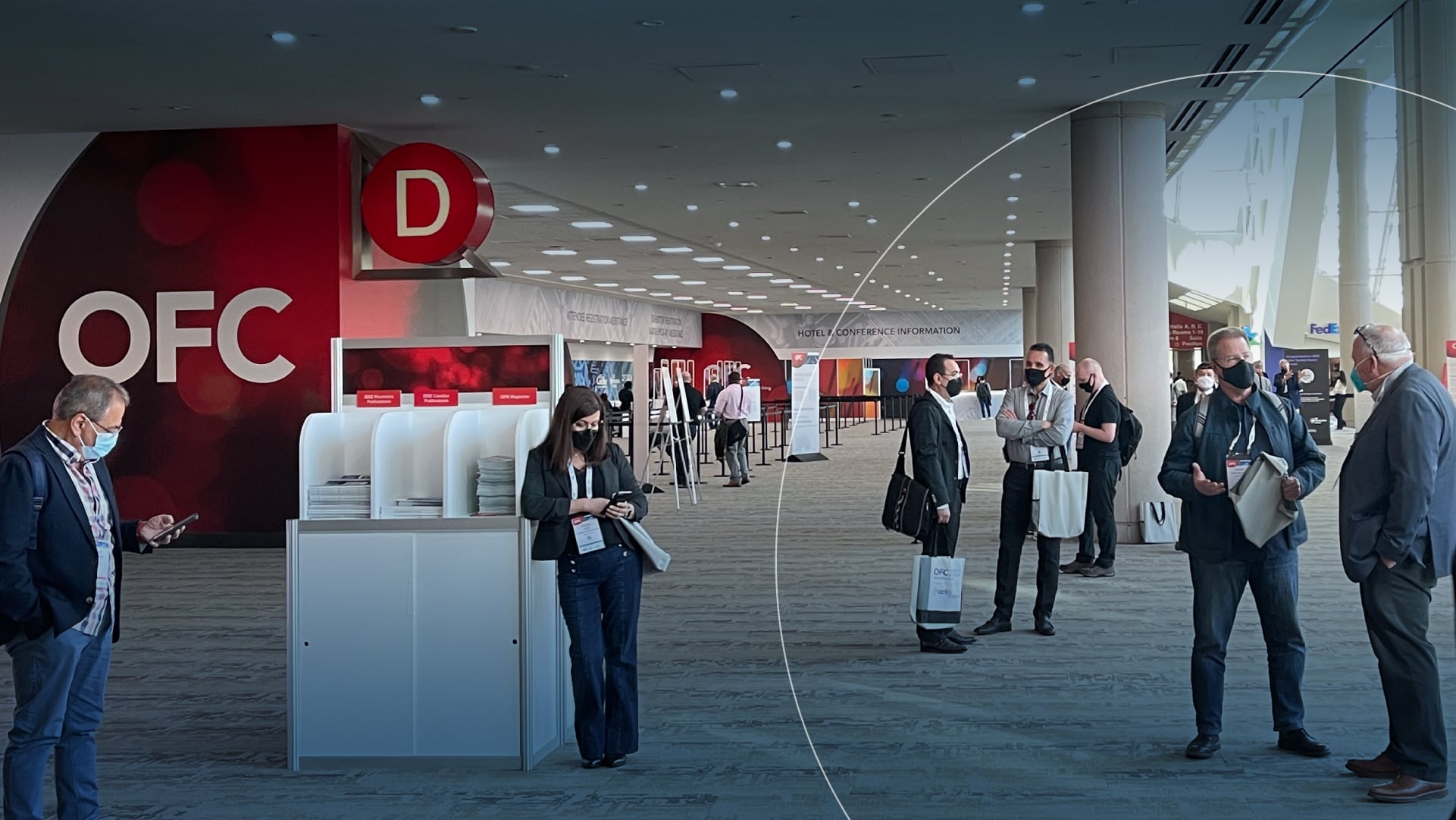 People standing in the lobby of a convention center